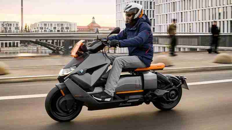 BMW CE 04 electric scooter riding on road