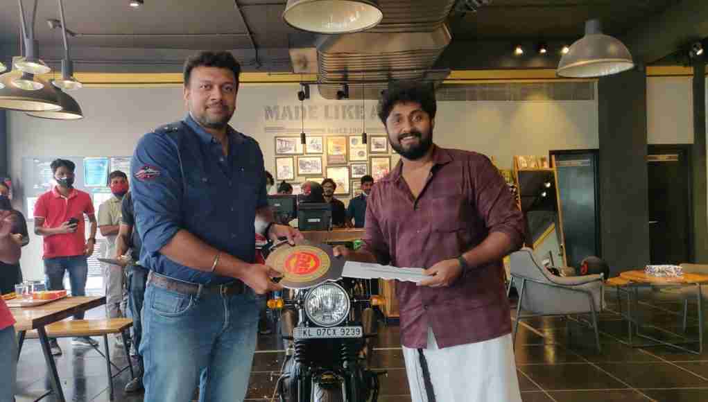 Dhyan Sreenivasan taking delivery of the Limited 120 years Anniversary Edition Interceptor 650